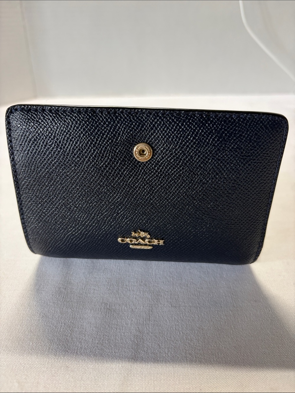 Coach Black pebble Textured Compact Wallet with Gold Logo